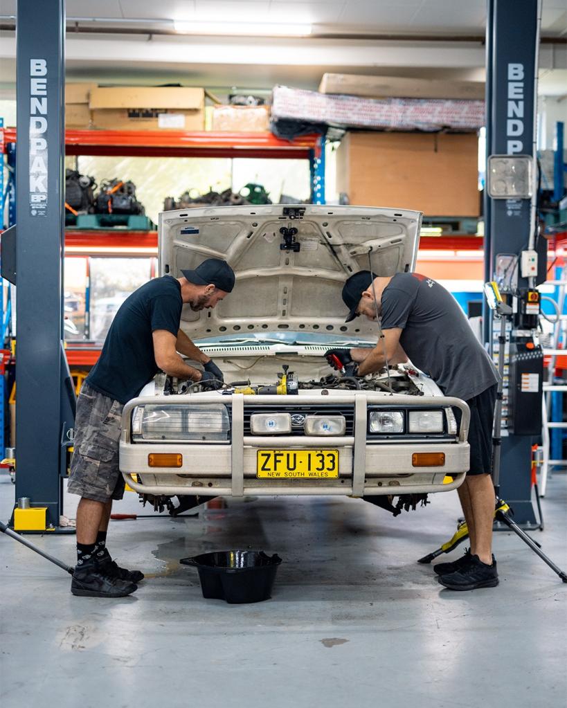 Top Gear Australia host Blair Joscelyne and Marty Mulholland working on a vehicle