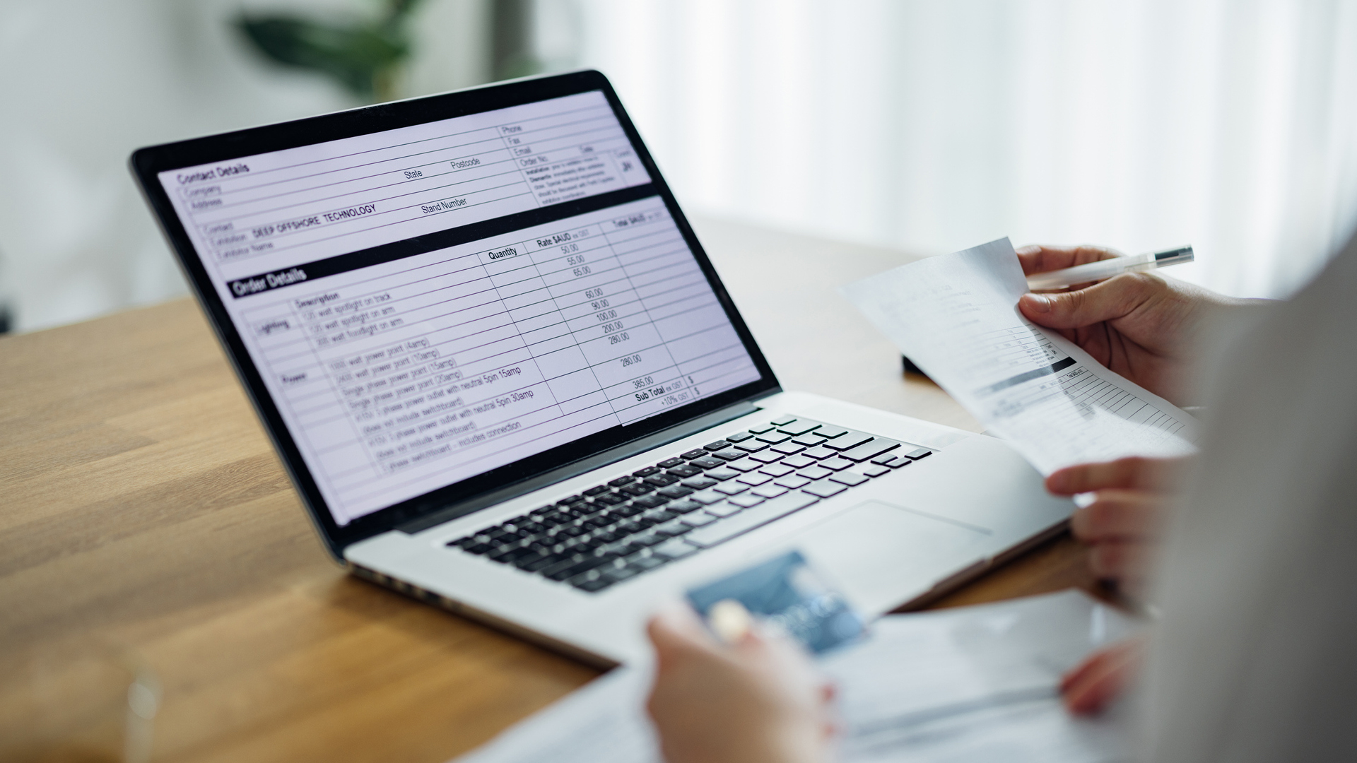 Unrecognizable Couple Paying Bills at Home